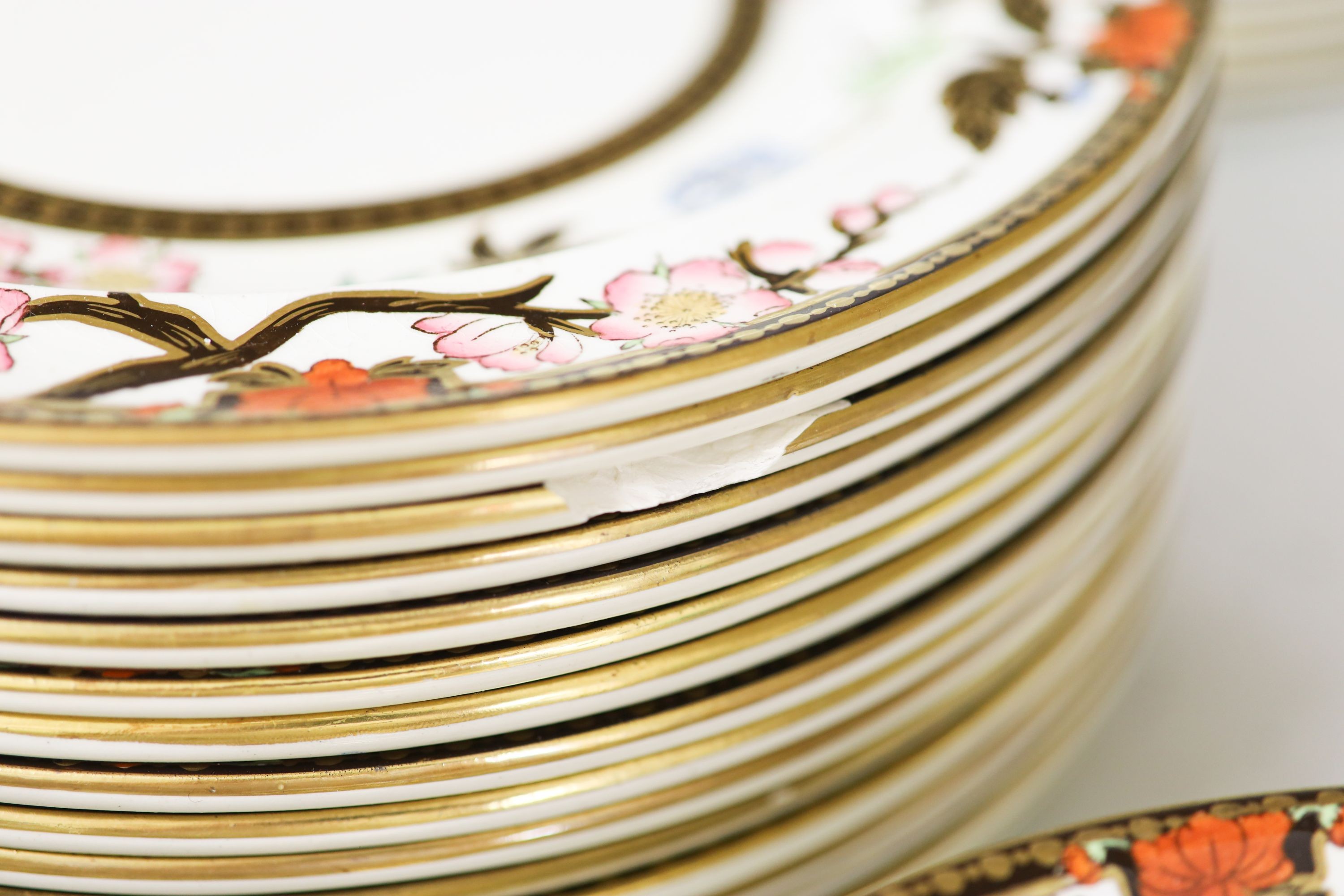 A Wedgwood Crescent pattern creamware part dinner service, the borders decorated with pink blossoms and chrysanthemums (approx. 65 pieces)